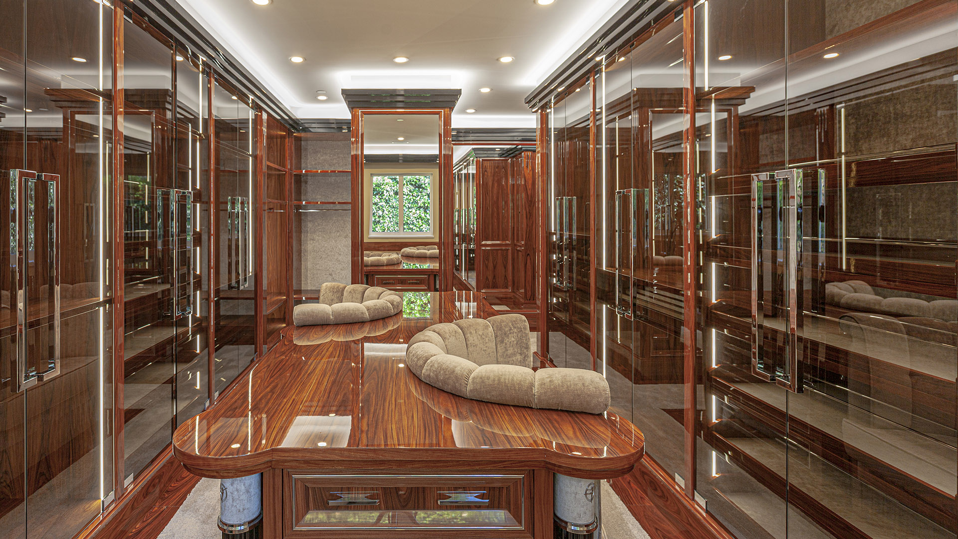 Altamont's Muse walk-in closet with rosewood and glass display cases in West Vancouver