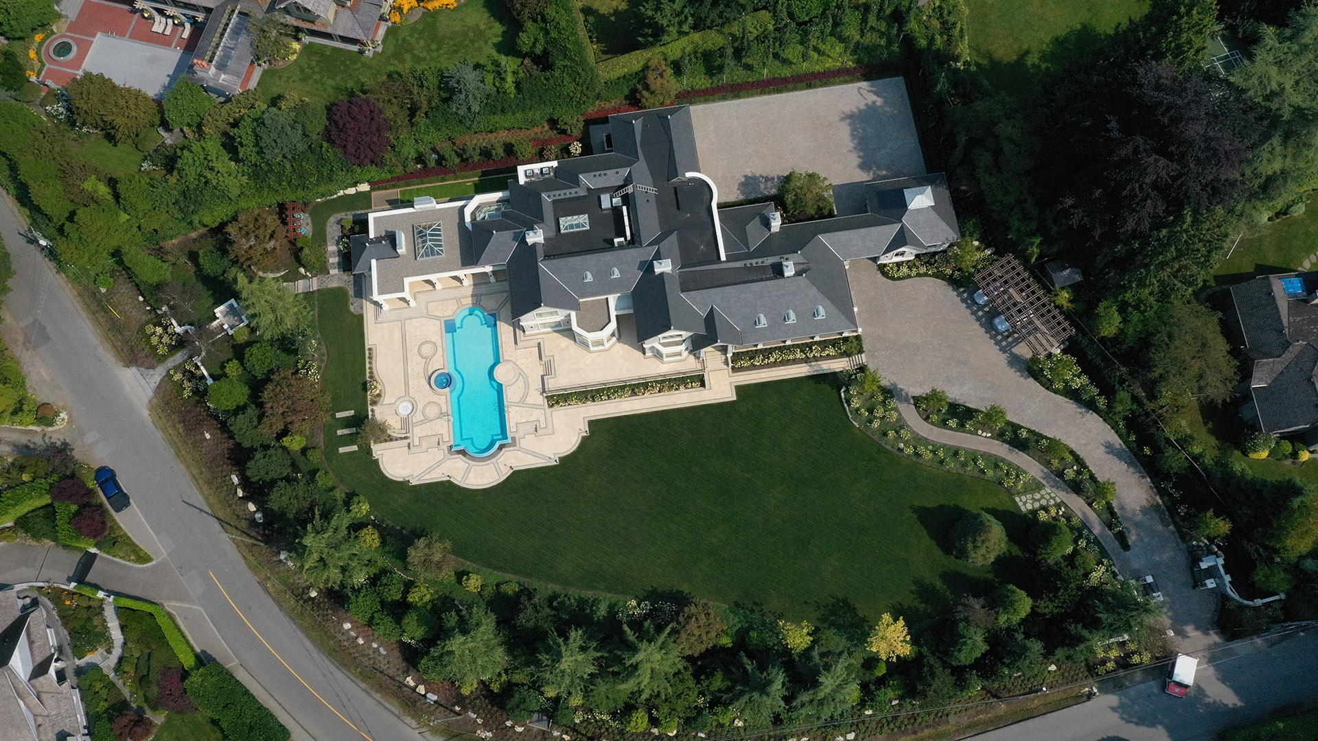 Altamont's Muse luxury estate aerial view showing pool terrace and grounds in West Vancouver