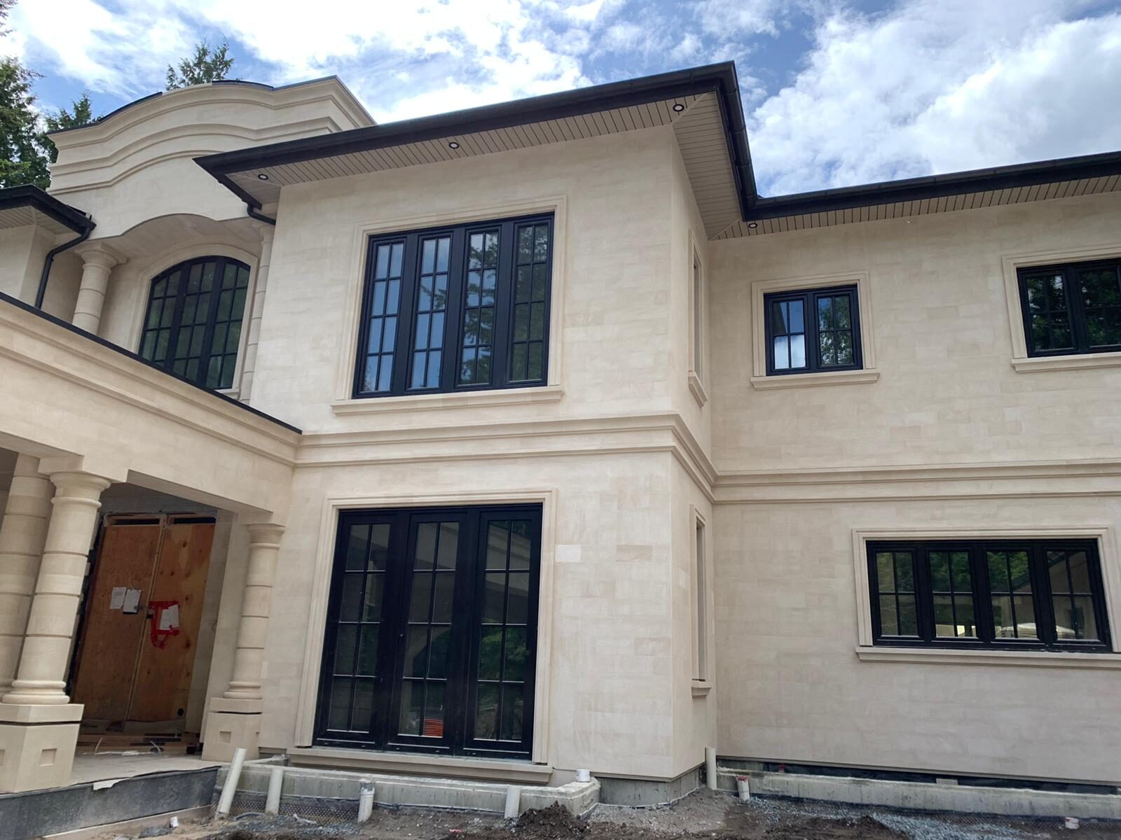 Side elevation showing sandstone coursing and window surrounds
