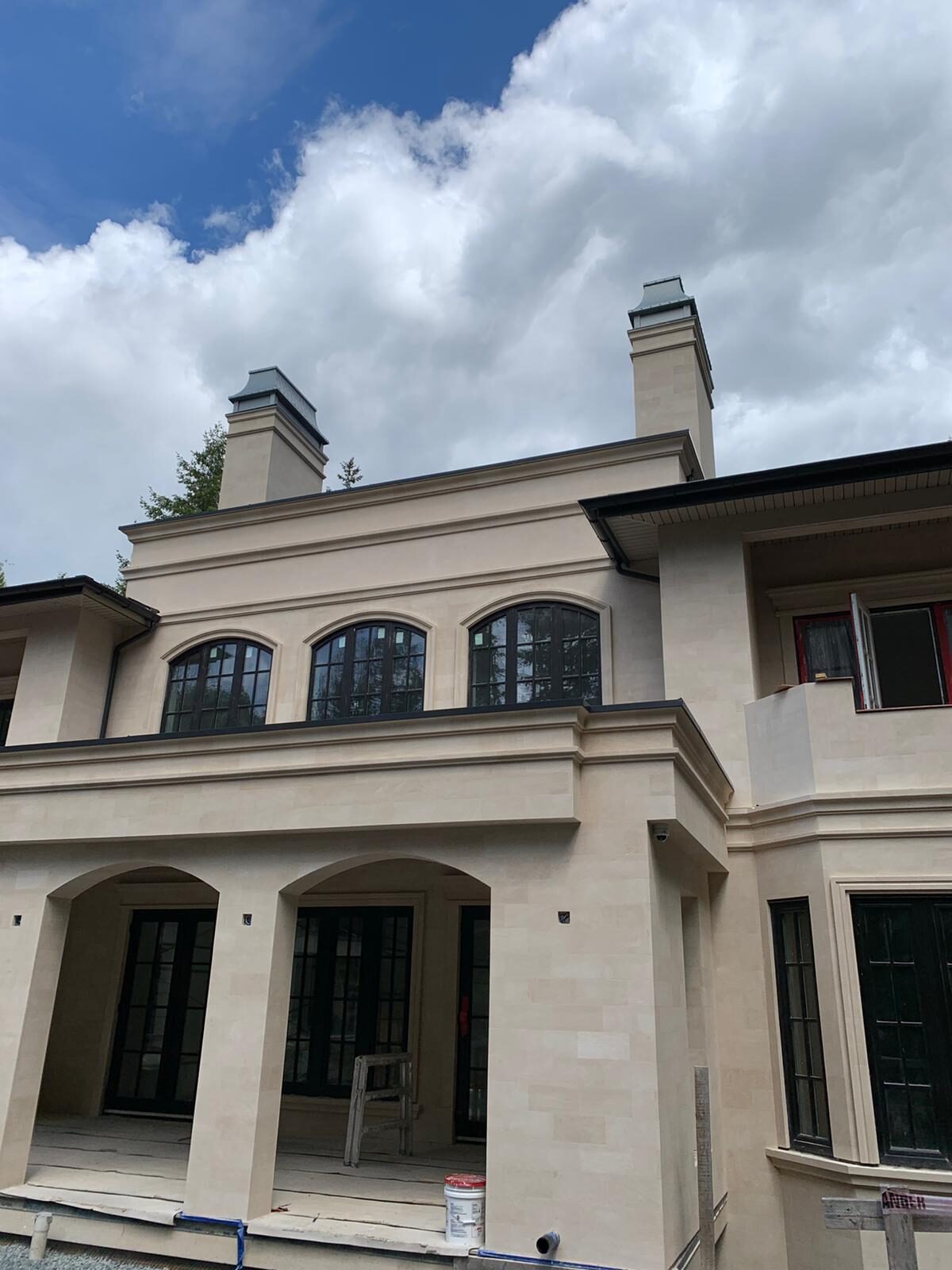 Rear elevation with twin chimneys and arched gallery