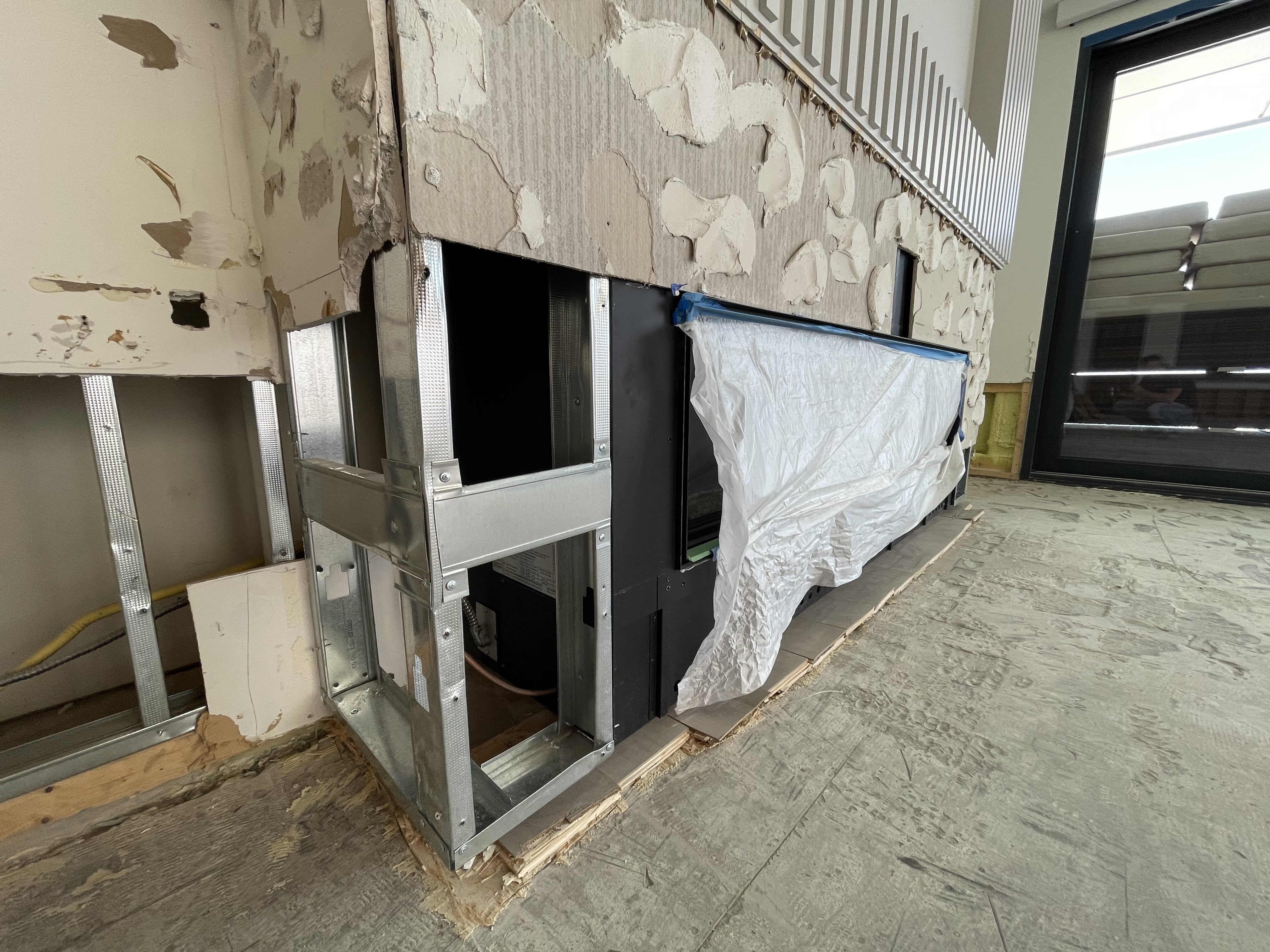 Interior stripped after water damage — reconstruction in progress