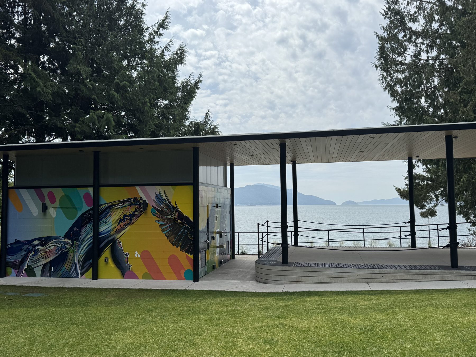 Pavilion and mural wall at Lions Bay Beach Park with ocean and mountain views