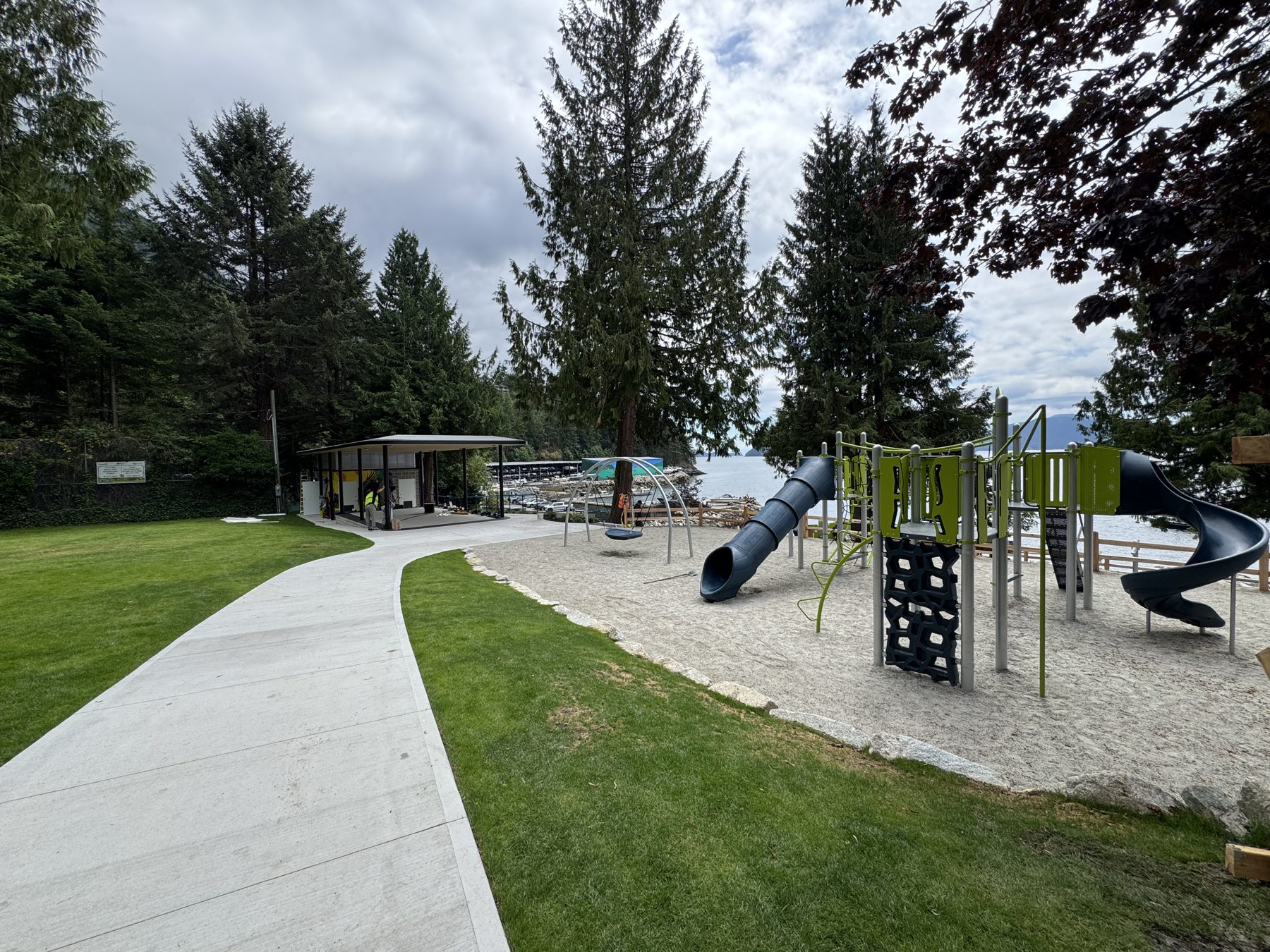 Completed Lions Bay Beach Park showing pavilion, pathways, lawn and new playground