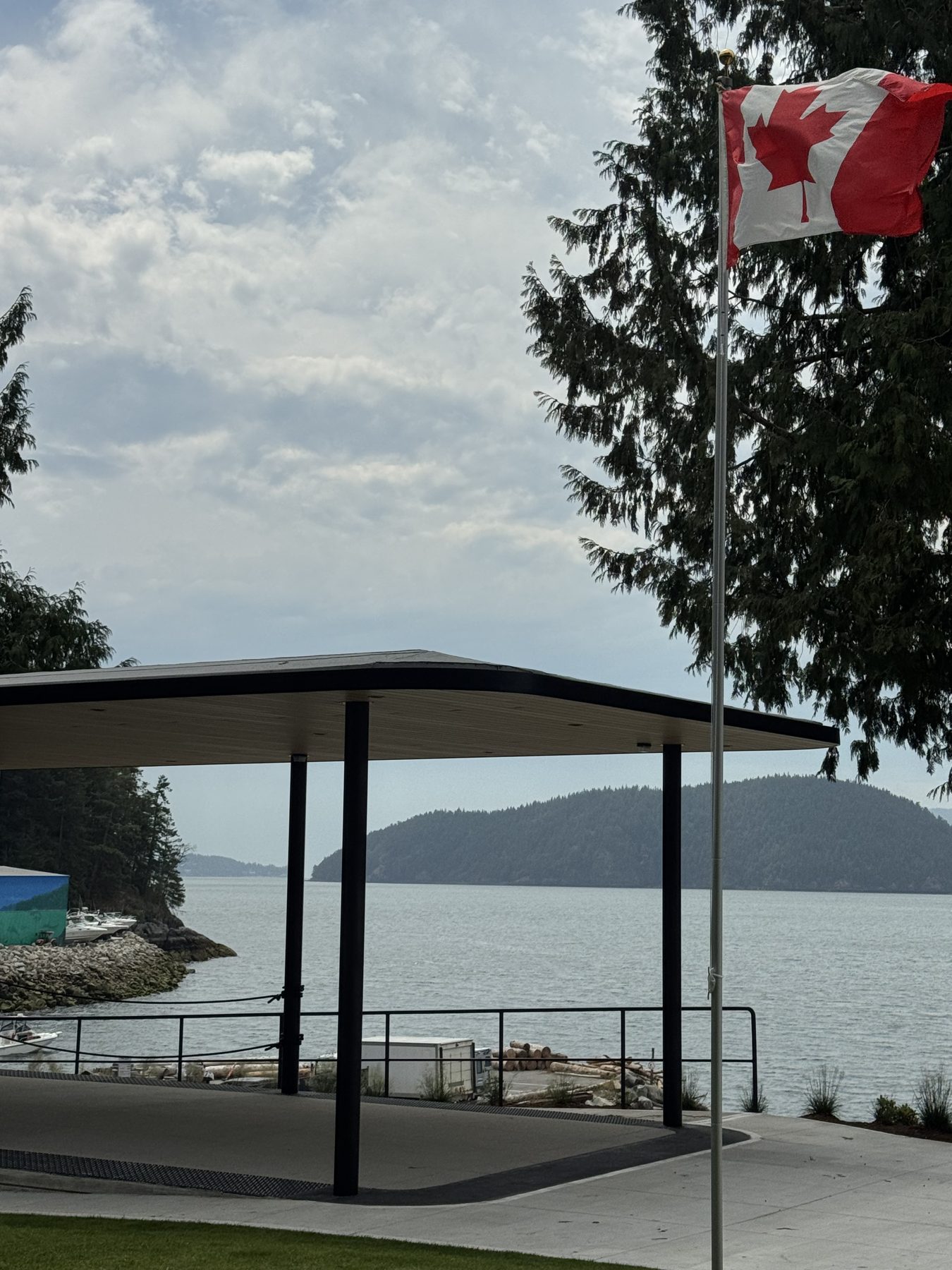 Pavilion and flagpole at Lions Bay Beach Park overlooking Howe Sound