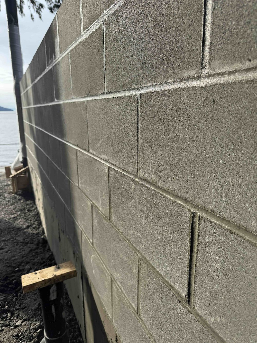 Reinforced concrete block wall with ocean view at Lions Bay Beach Park by Eurohouse Construction