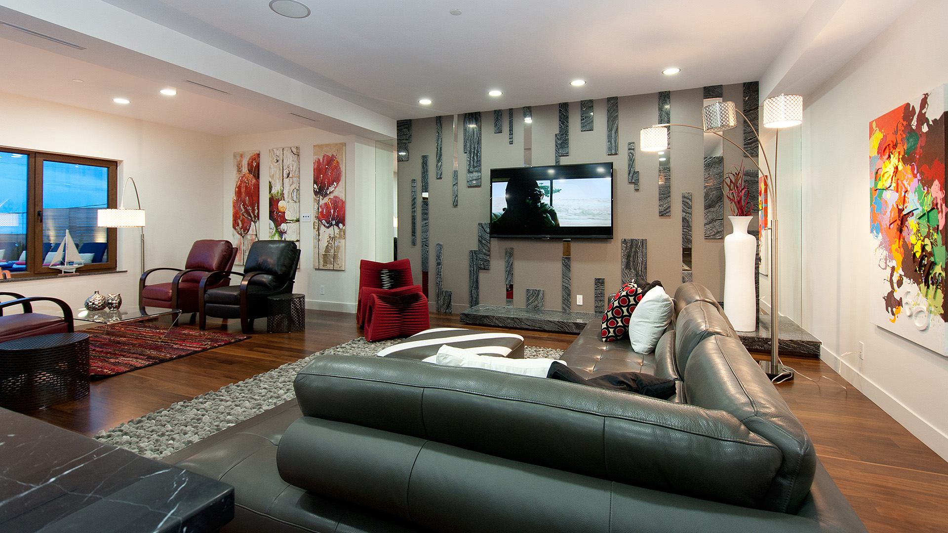 Kitchen detail showing Italian cabinetry glass backsplash granite countertops and open plan flow to living area Millstream British Properties luxury home West Vancouver