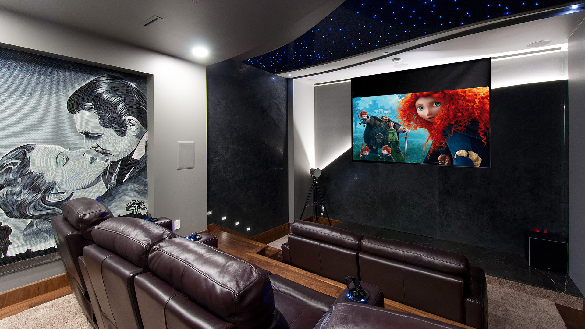 Home theatre with fibre-optic star ceiling tiered leather recliners custom mosaic mural and professional projection system Millstream British Properties West Vancouver
