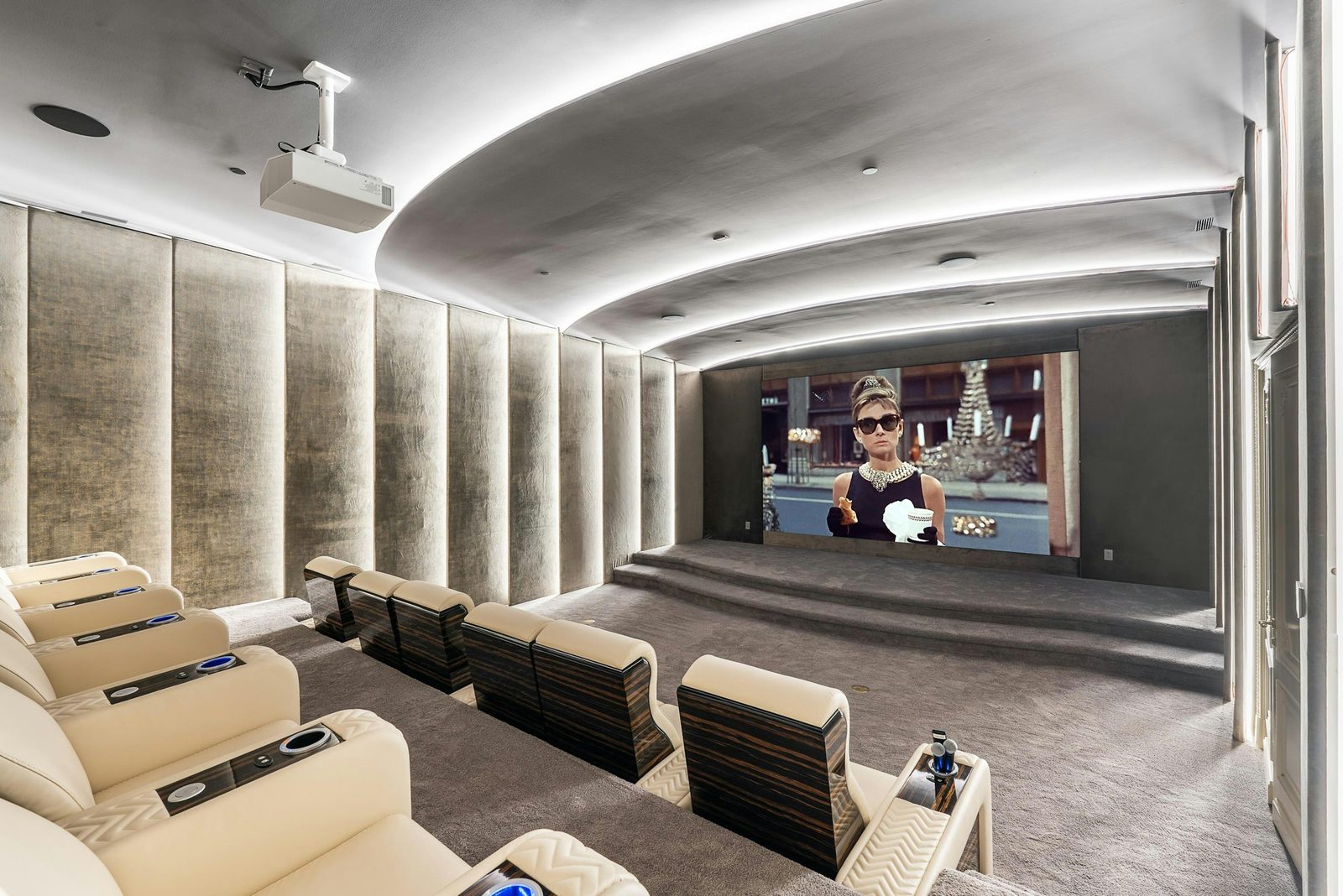 Private home theater with projector screen and leather recliners at Montbeau Eyremount West Vancouver