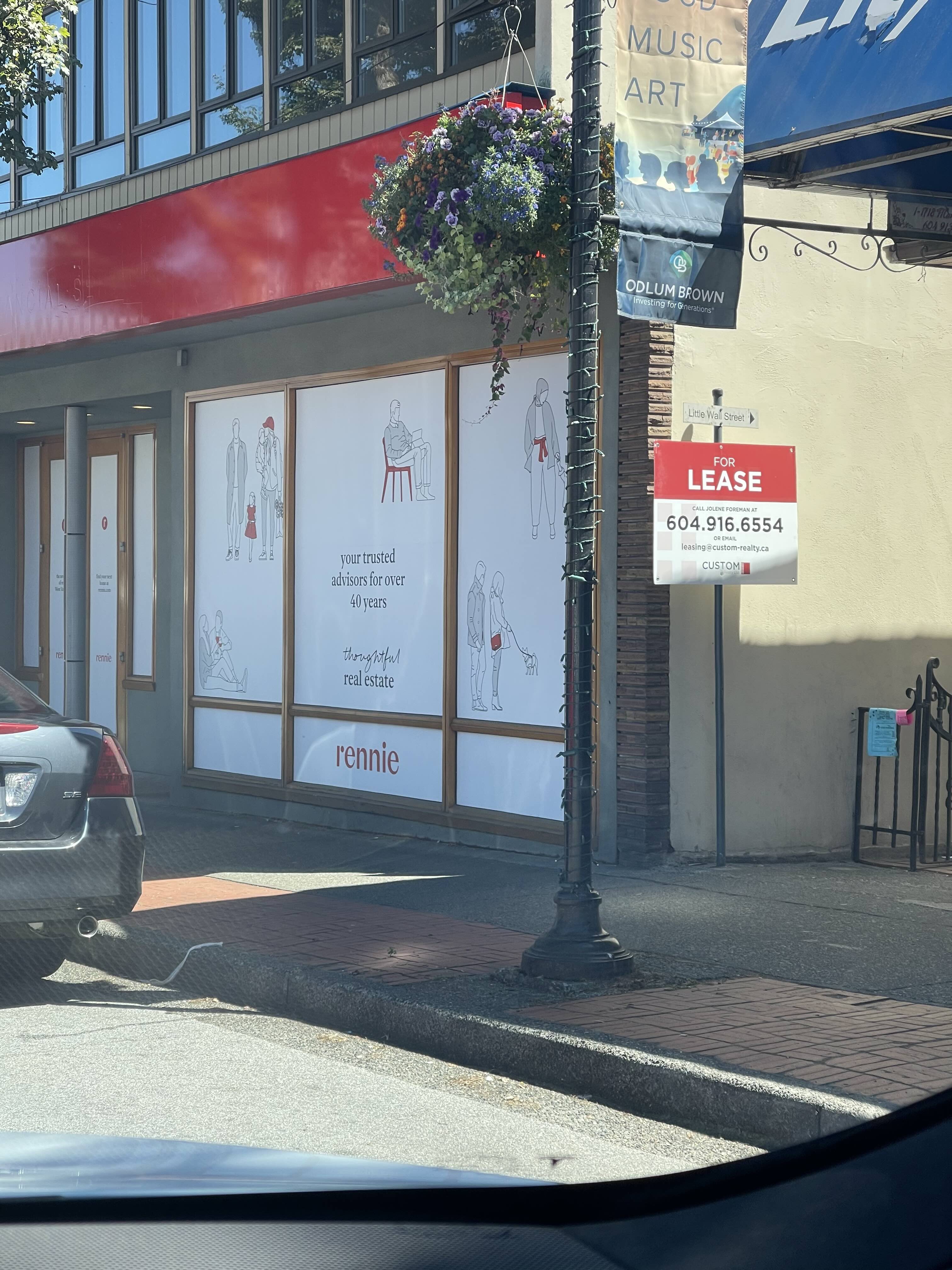 Completed Rennie storefront on Marine Drive West Vancouver — branded signage and window displays