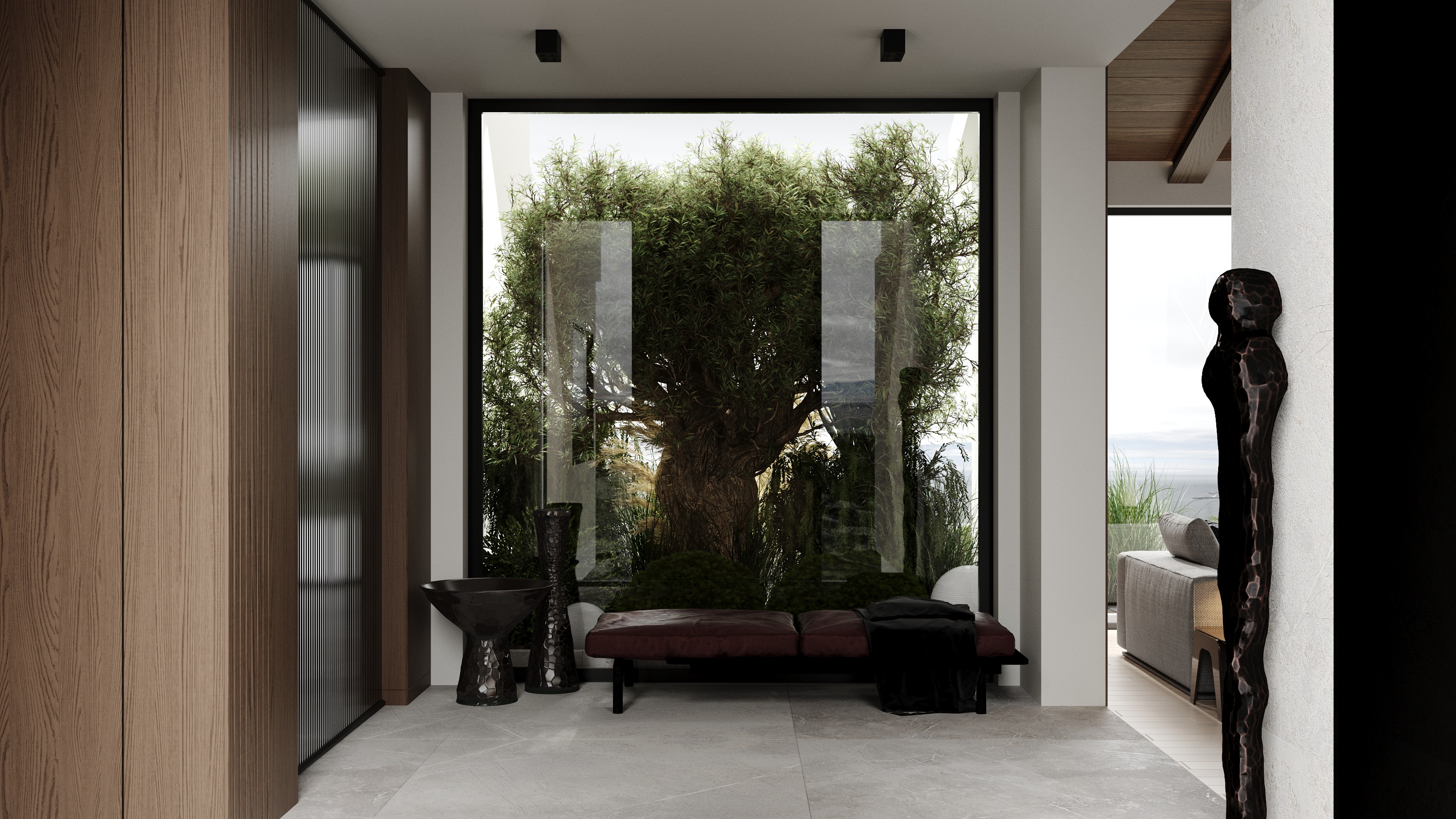 Entry atrium with olive tree and sculptural art at Scandinavian barn house West Vancouver by Eurohouse Construction