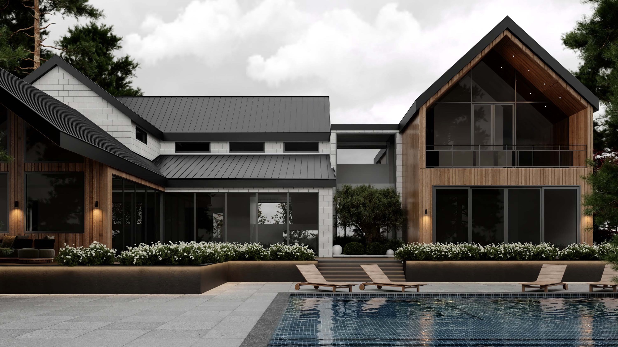 Rear pool-side elevation with standing-seam roof, white stone, and cedar at Scandinavian barn house Spencer Road West Vancouver by Eurohouse Construction