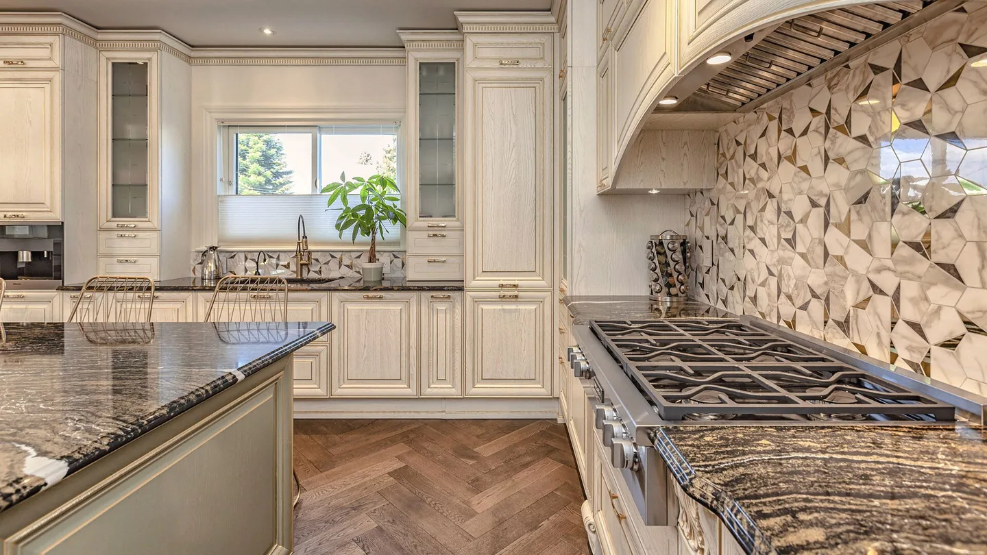 Detail of European kitchen cabinetry and integrated appliances by Eurohouse Construction