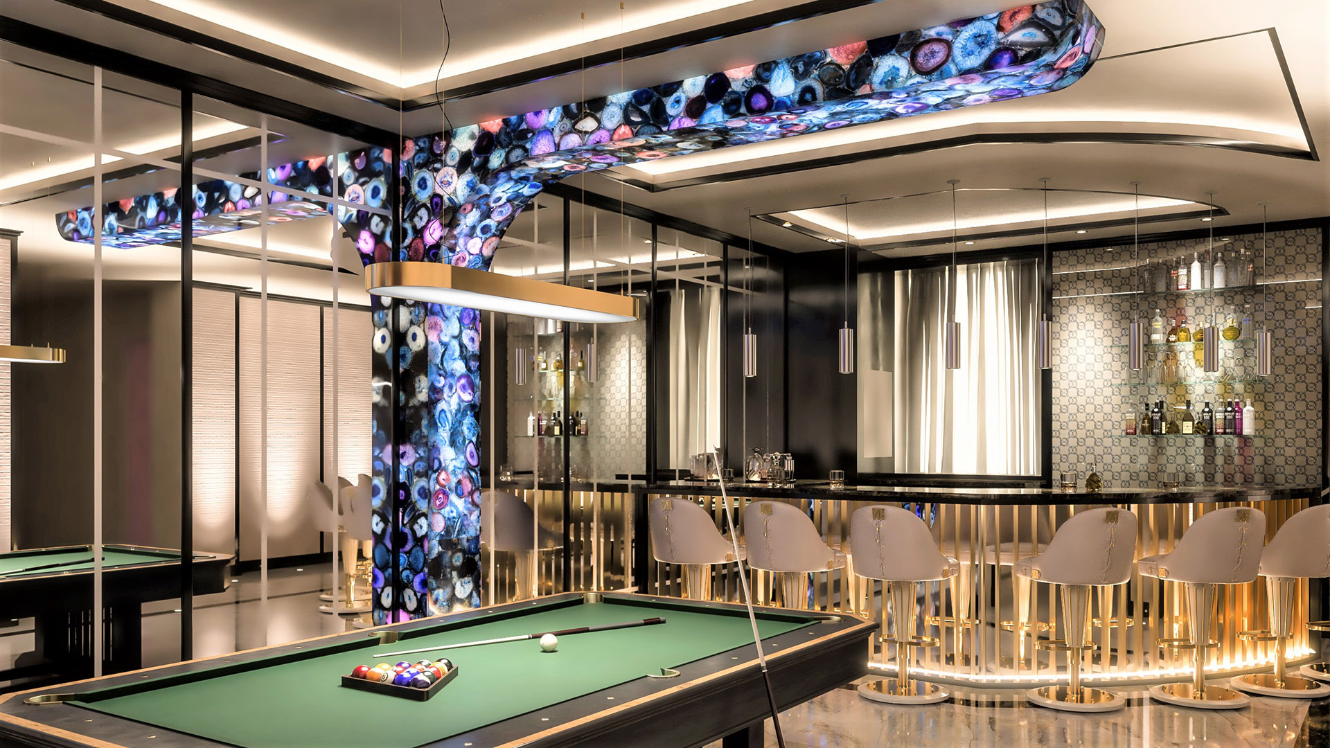 Full cocktail bar with backlit agate column, gold bar stools, and pendant lighting in The H House entertainment wing — ultra-luxury residence built by Eurohouse Construction West Vancouver