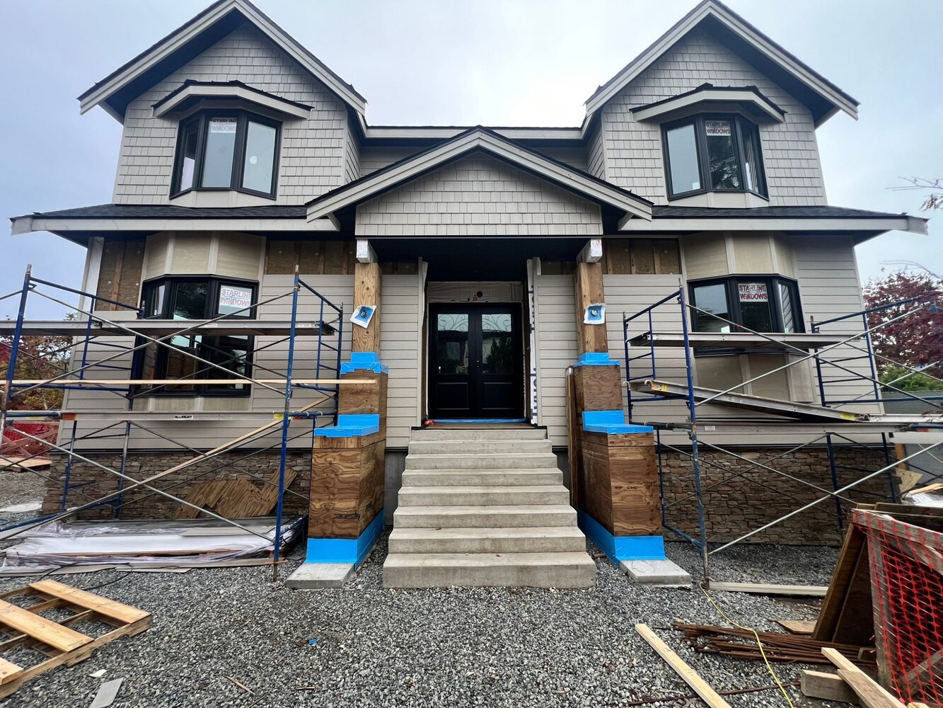 Front exterior with siding nearly complete