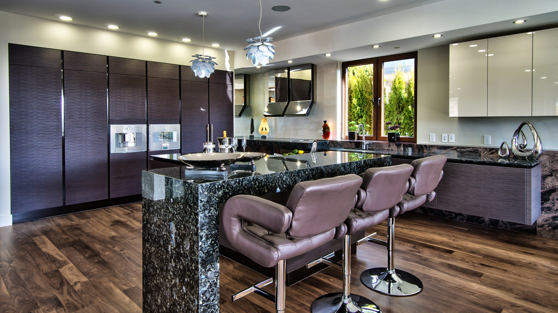 Kitchen bar seating with leather stools granite waterfall island and Italian textured cabinets West Bay West Vancouver