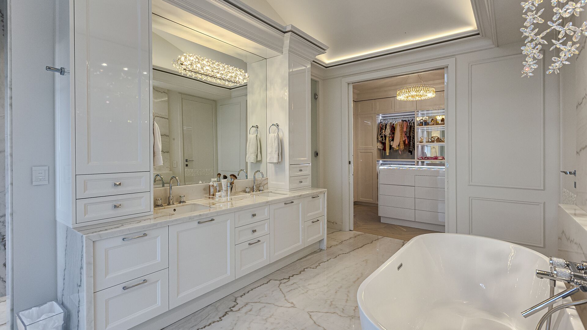 Master bathroom double vanity with crystal lighting walk-in closet and freestanding tub West Vancouver luxury home Eurohouse
